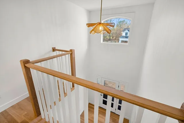 a view of staircase with wooden floor