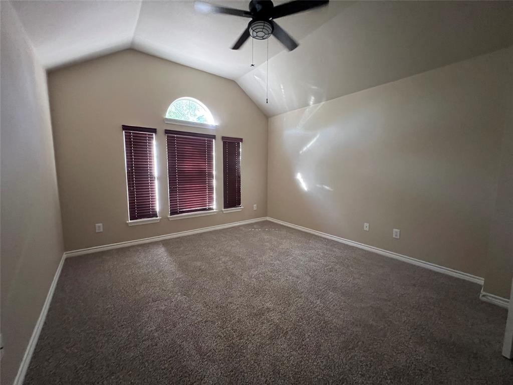 8158 Painted Tree Trail Fort Worth, TX 76131 - Photo 12 of 18 an empty room with windows and fan