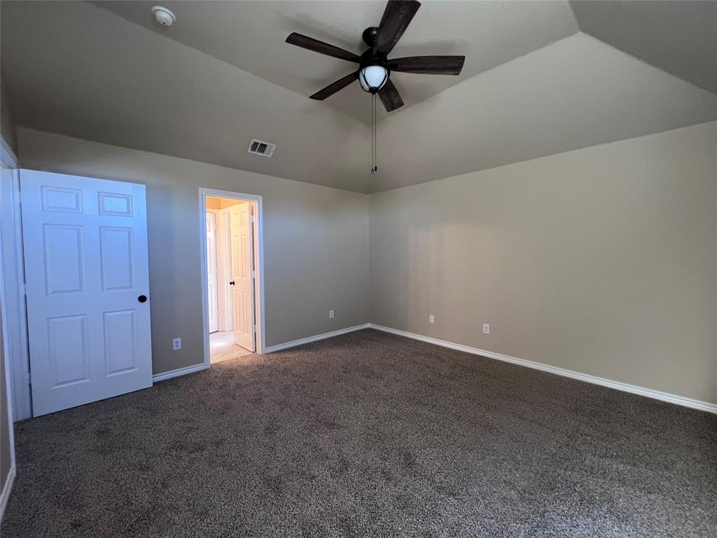 8158 Painted Tree Trail Fort Worth, TX 76131 - Photo 13 of 18 a view of an empty room and a ceiling fan