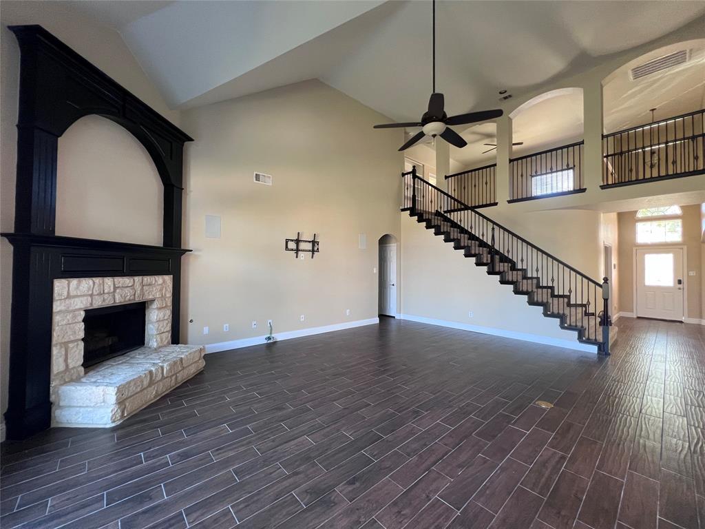 8158 Painted Tree Trail Fort Worth, TX 76131 - Photo 6 of 18 a view of empty room with wooden floor and fireplace