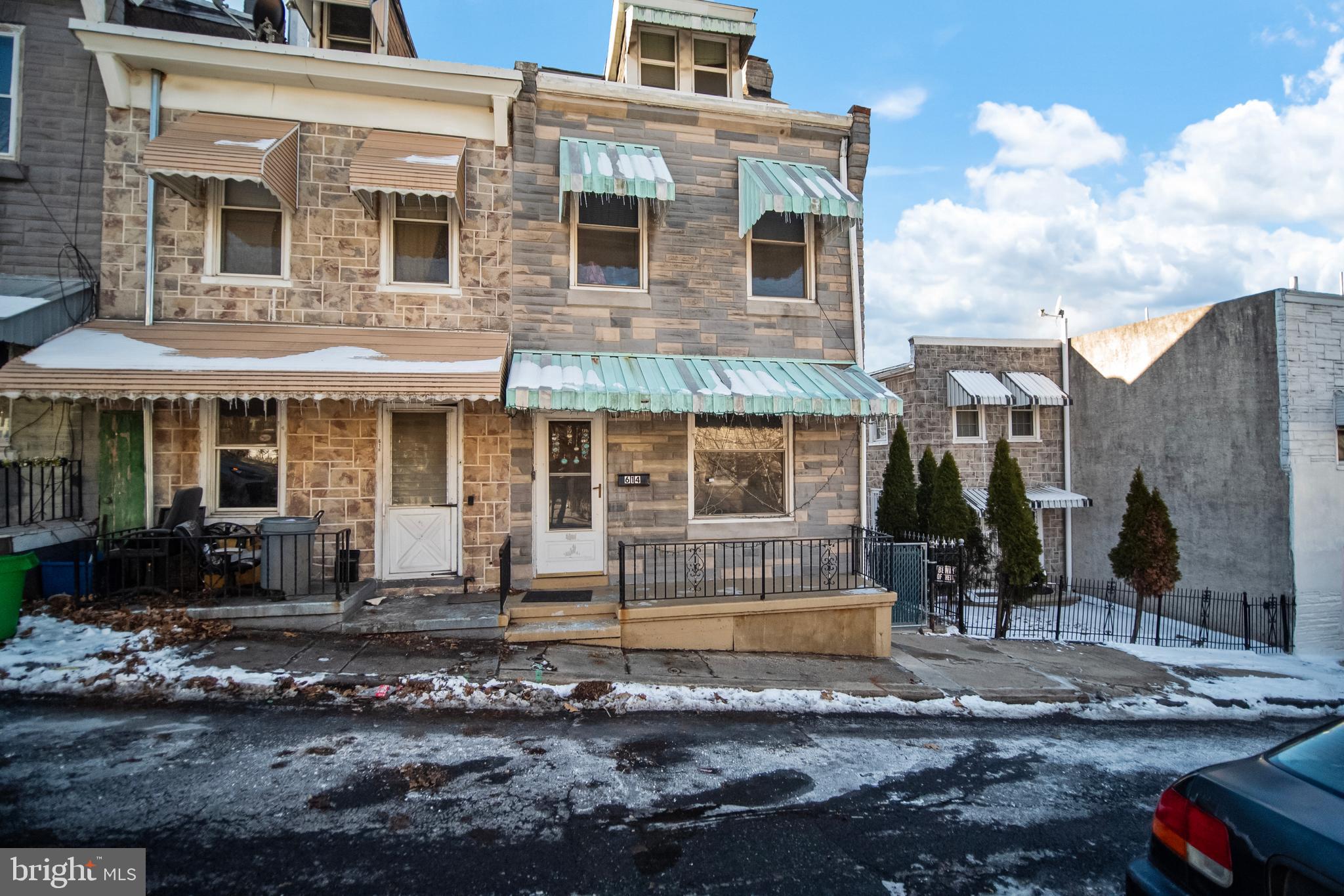 614 Maple Street Reading, PA 19602 - Photo 1 of 23 a front view of a house with garden
