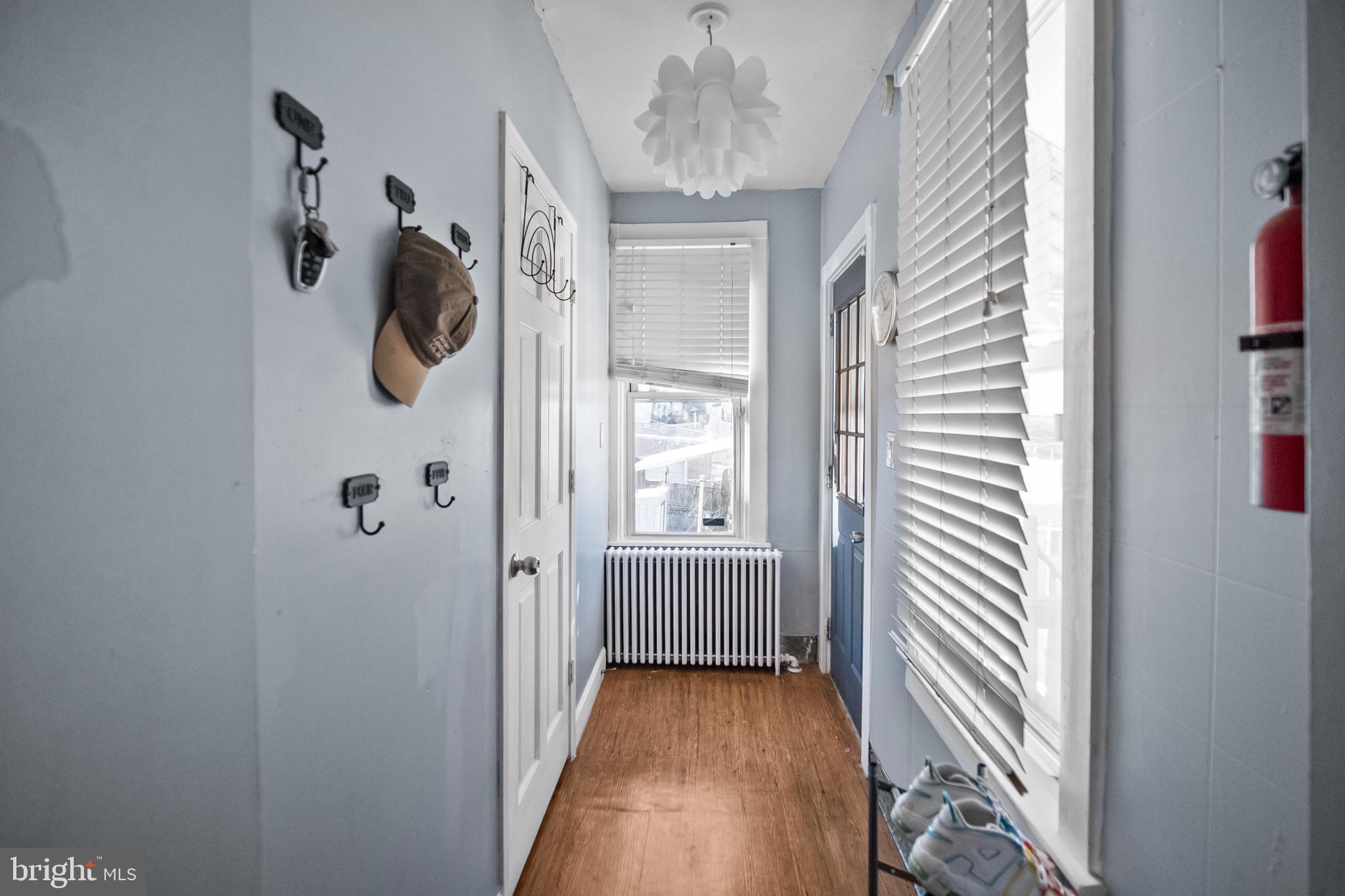 614 Maple Street Reading, PA 19602 - Photo 12 of 23 a view of a room that has a large window wooden floor and front door