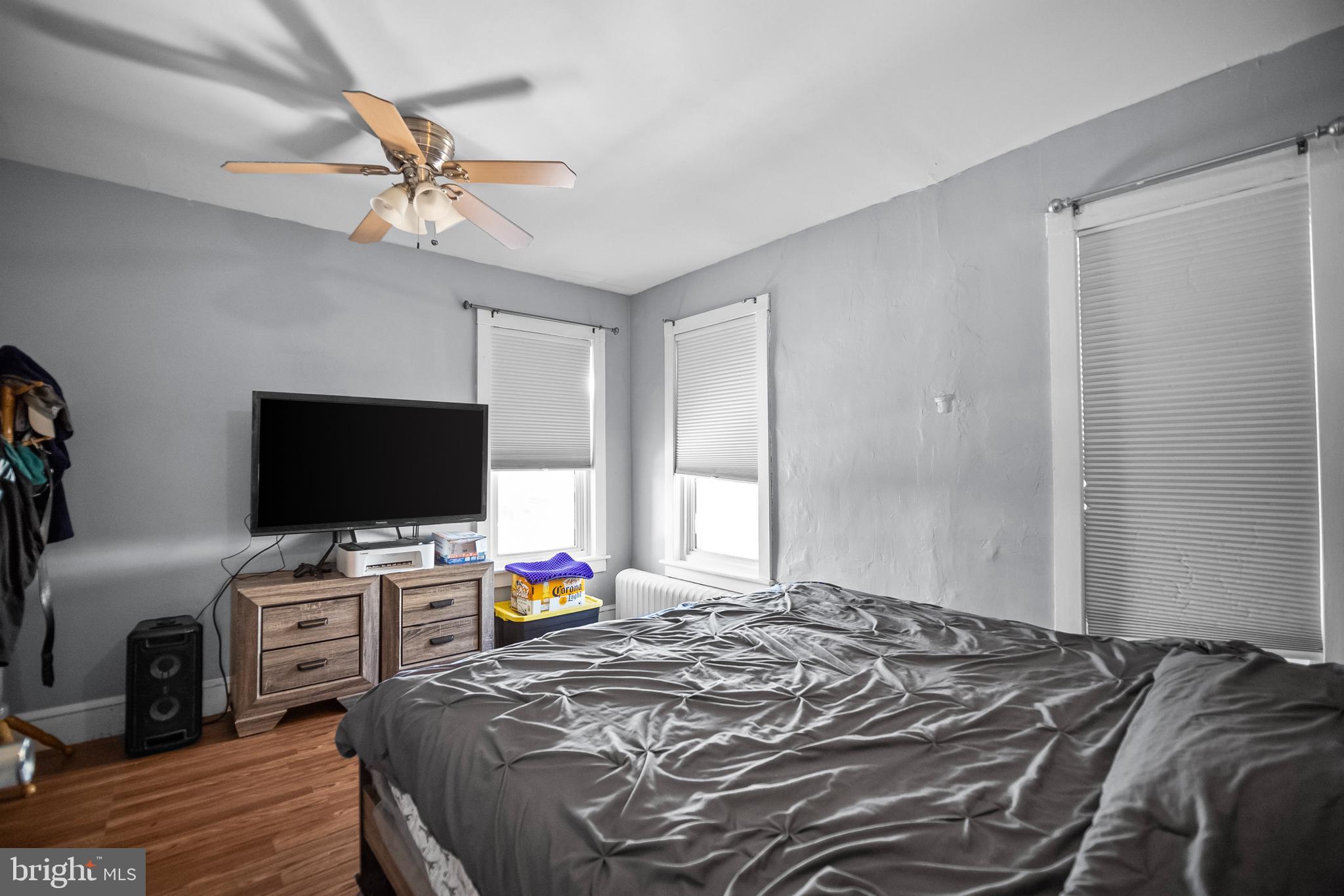 614 Maple Street Reading, PA 19602 - Photo 15 of 23 a bedroom with a bed and a flat screen tv