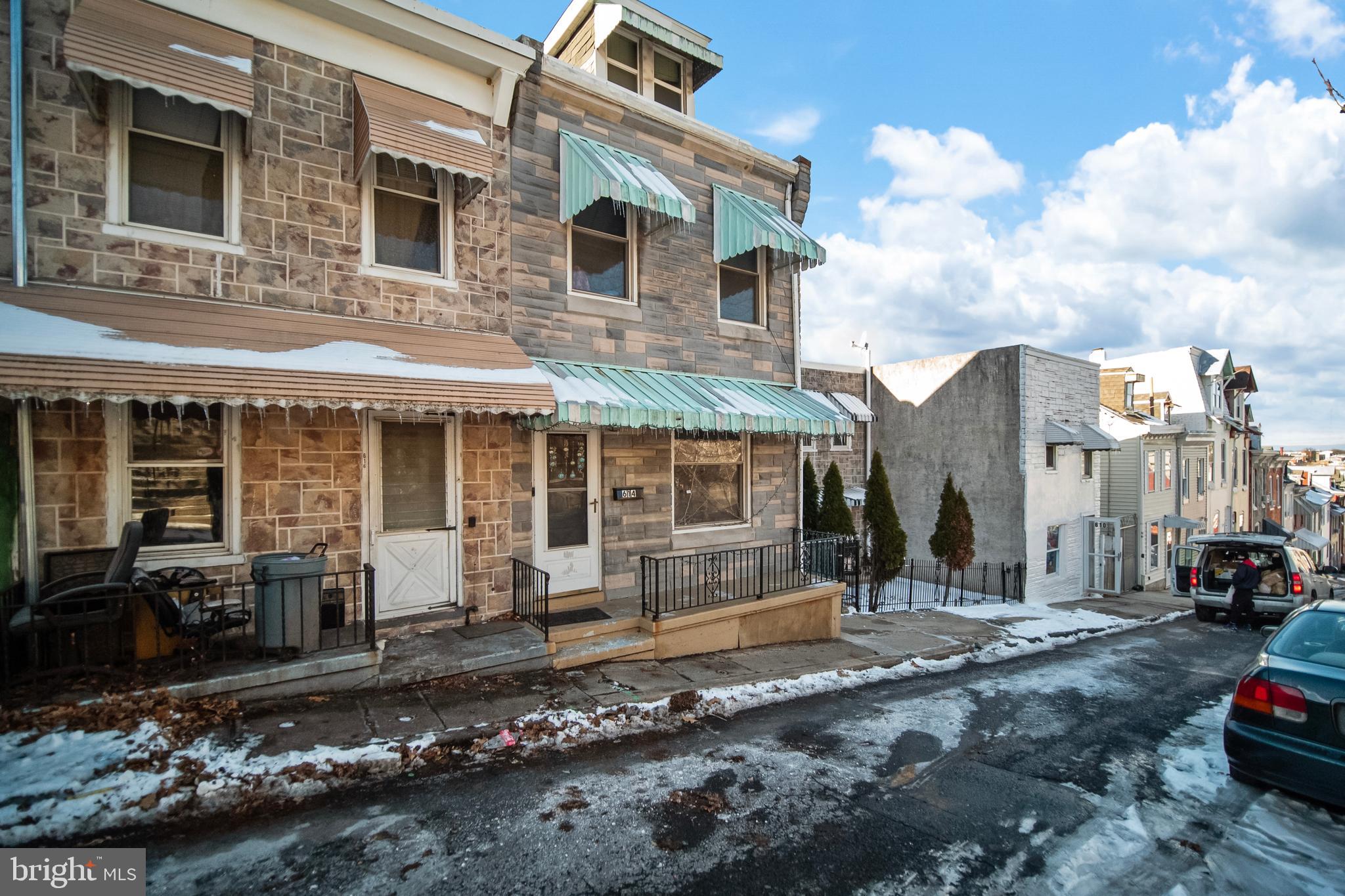 614 Maple Street Reading, PA 19602 - Photo 2 of 23 a front view of a house with a yard