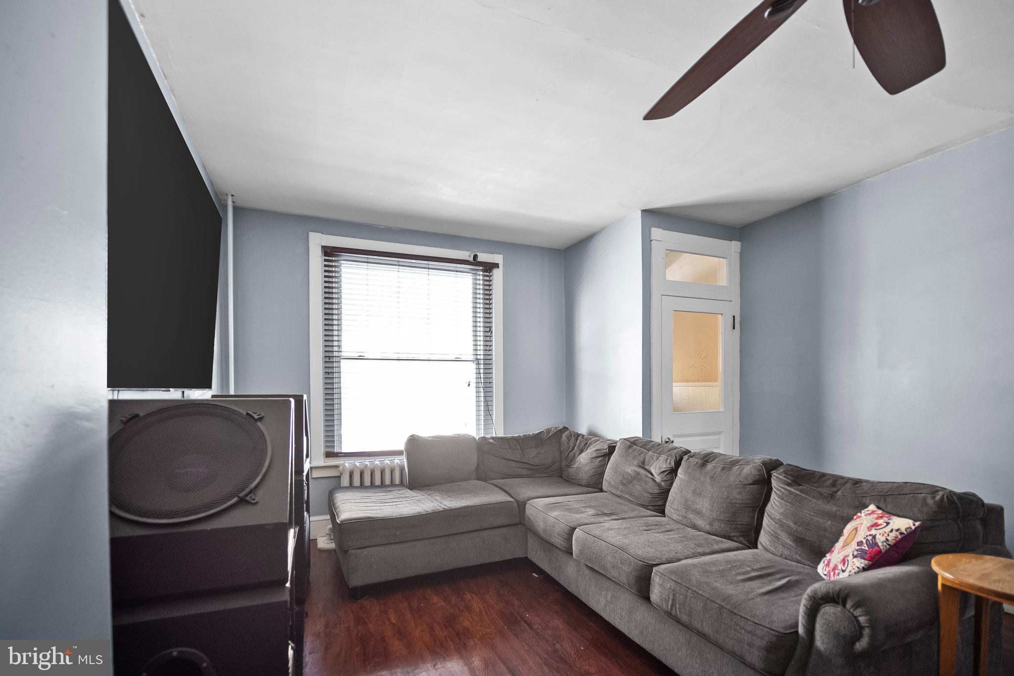 614 Maple Street Reading, PA 19602 - Photo 4 of 23 a living room with furniture and a window