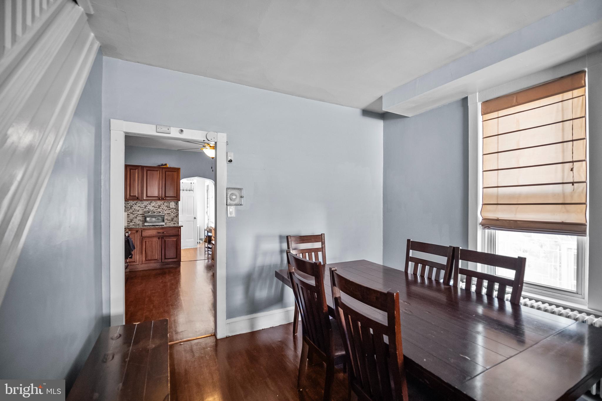 614 Maple Street Reading, PA 19602 - Photo 7 of 23 a view of a dining room with furniture and wooden floor