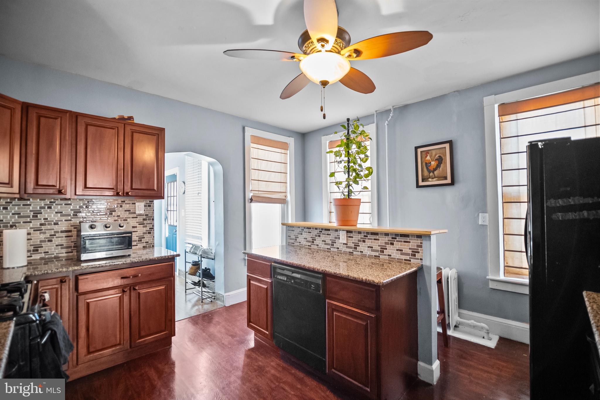 614 Maple Street Reading, PA 19602 - Photo 10 of 23 a kitchen with stainless steel appliances granite countertop a stove cabinets and wooden floor
