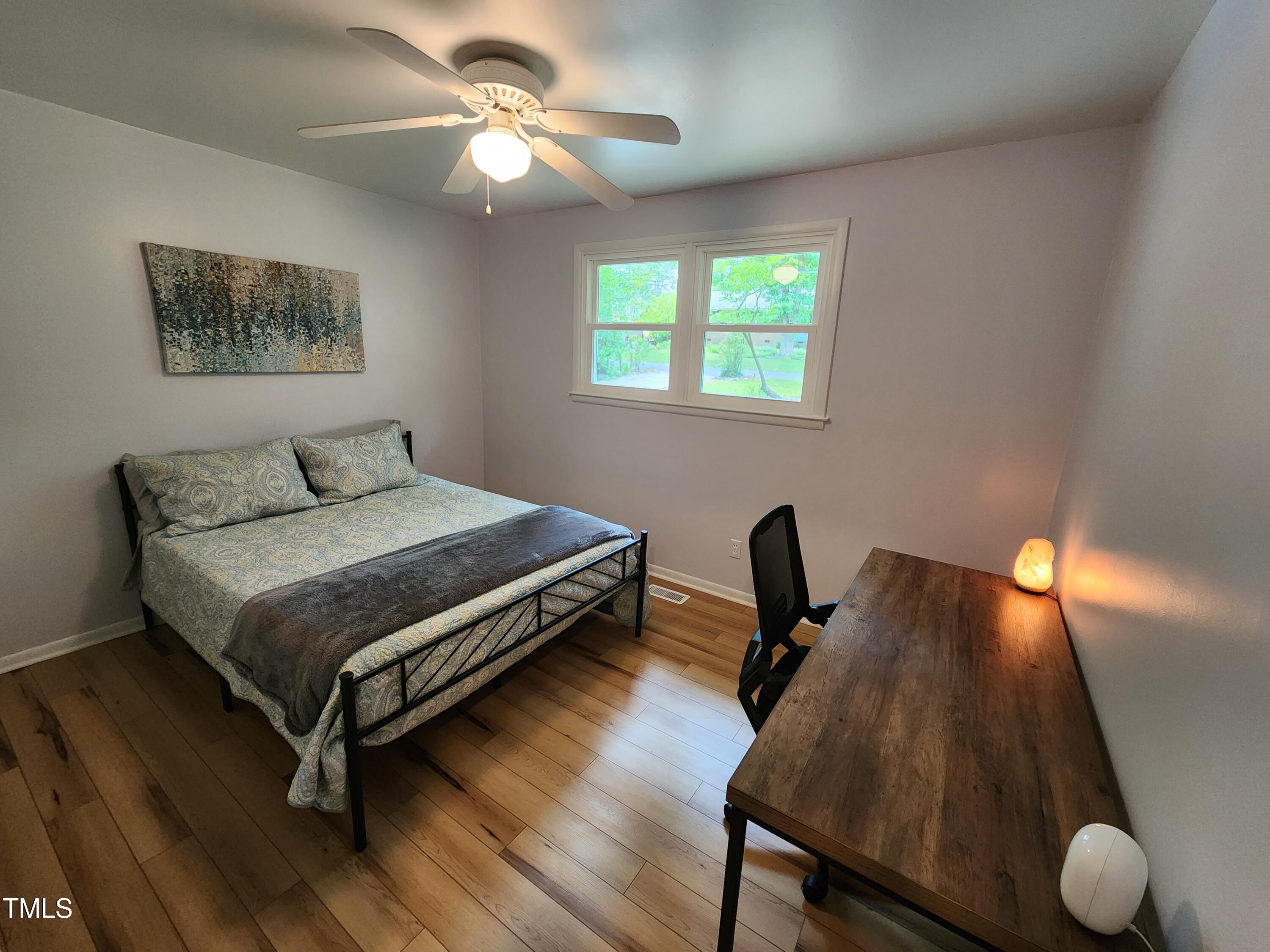 427 Ridgefield Road Chapel Hill, NC 27517 - Photo 16 of 27 a bedroom with furniture and a window