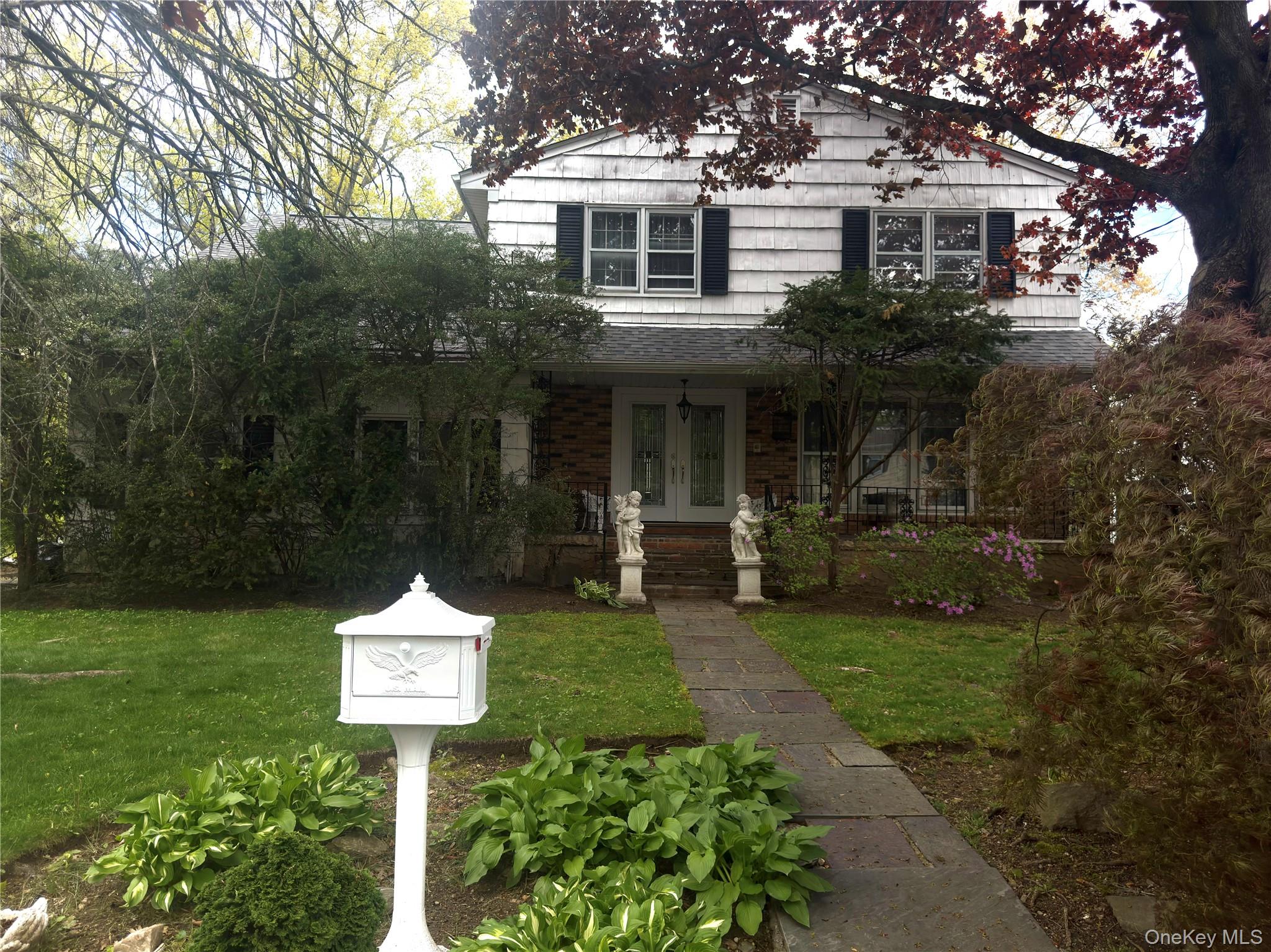 20 Old Farm Road Scarsdale, NY 10583 - Photo 2 of 27 a front view of a house with a yard and tree s