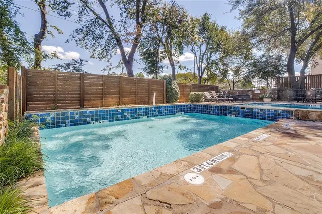 a picture of a bench in front of a wall