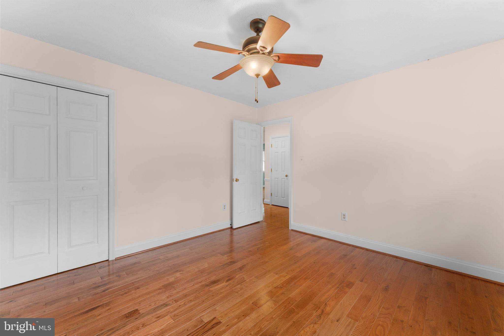 13360 Cameron Court Boston, VA 22713 - Photo 61 of 76 a view of an empty room with wooden floor
