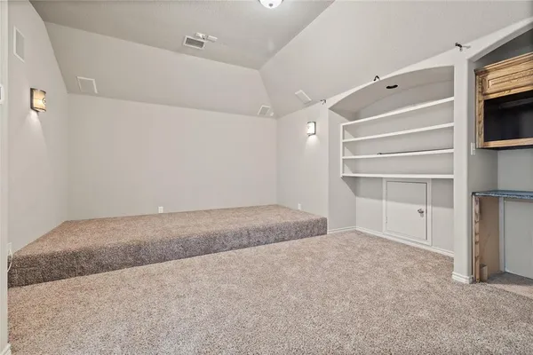 an empty room with windows and closet