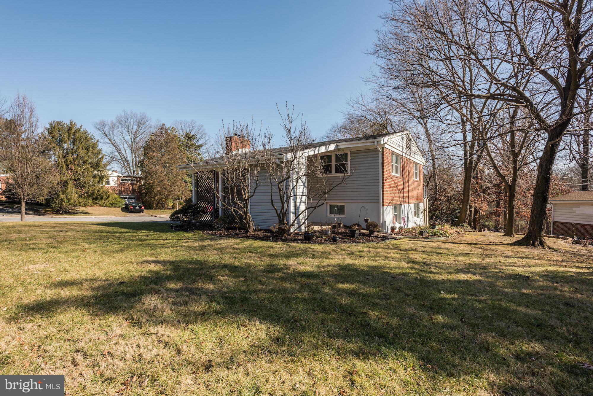 6705 Maxalea Road Baltimore, MD 21239 - Photo 2 of 30 a view of a town with large trees
