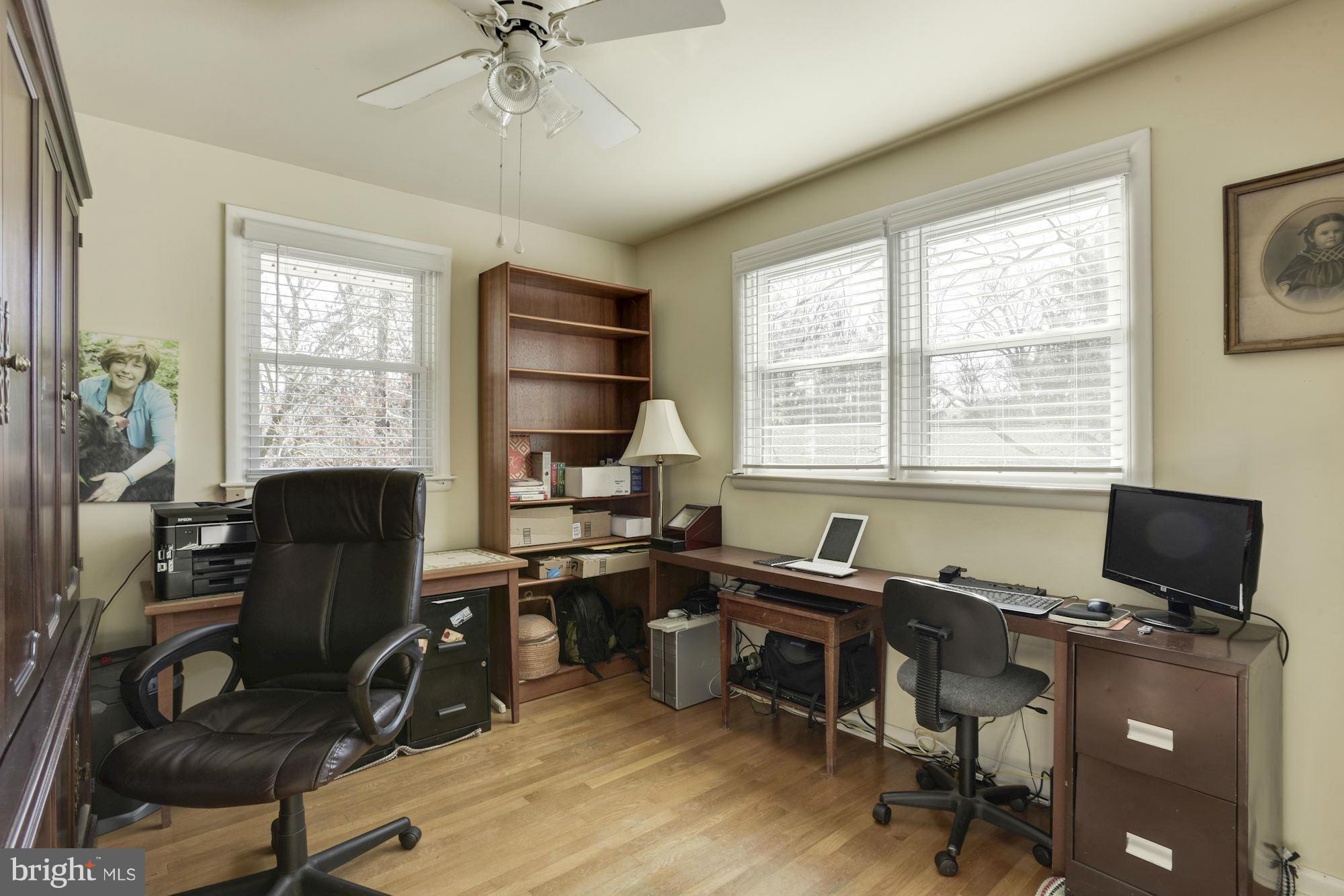 6705 Maxalea Road Baltimore, MD 21239 - Photo 14 of 30 a view of a workspace with furniture and a window