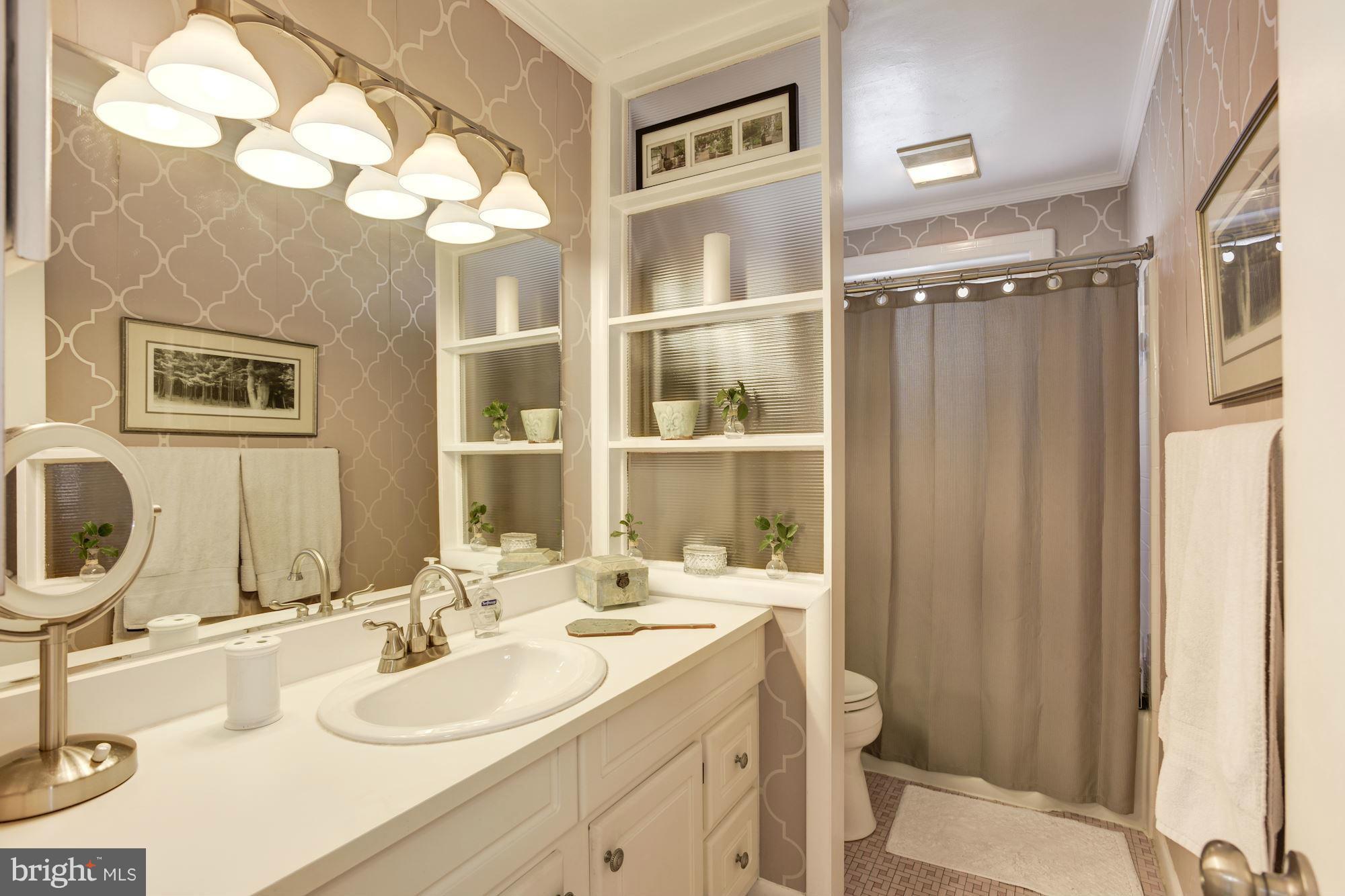 6705 Maxalea Road Baltimore, MD 21239 - Photo 15 of 30 a bathroom with a double vanity sink mirror and
