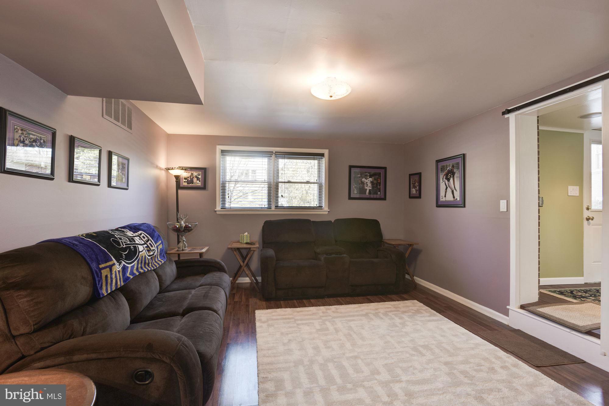 6705 Maxalea Road Baltimore, MD 21239 - Photo 21 of 30 a living room with furniture and a window