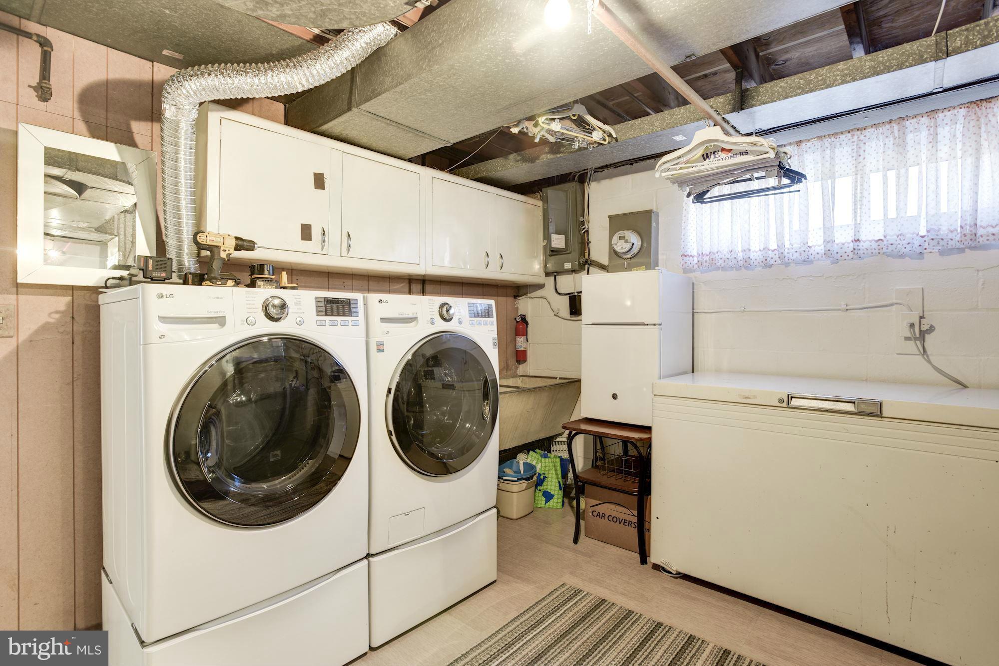 6705 Maxalea Road Baltimore, MD 21239 - Photo 24 of 30 a utility room with dryer and washer