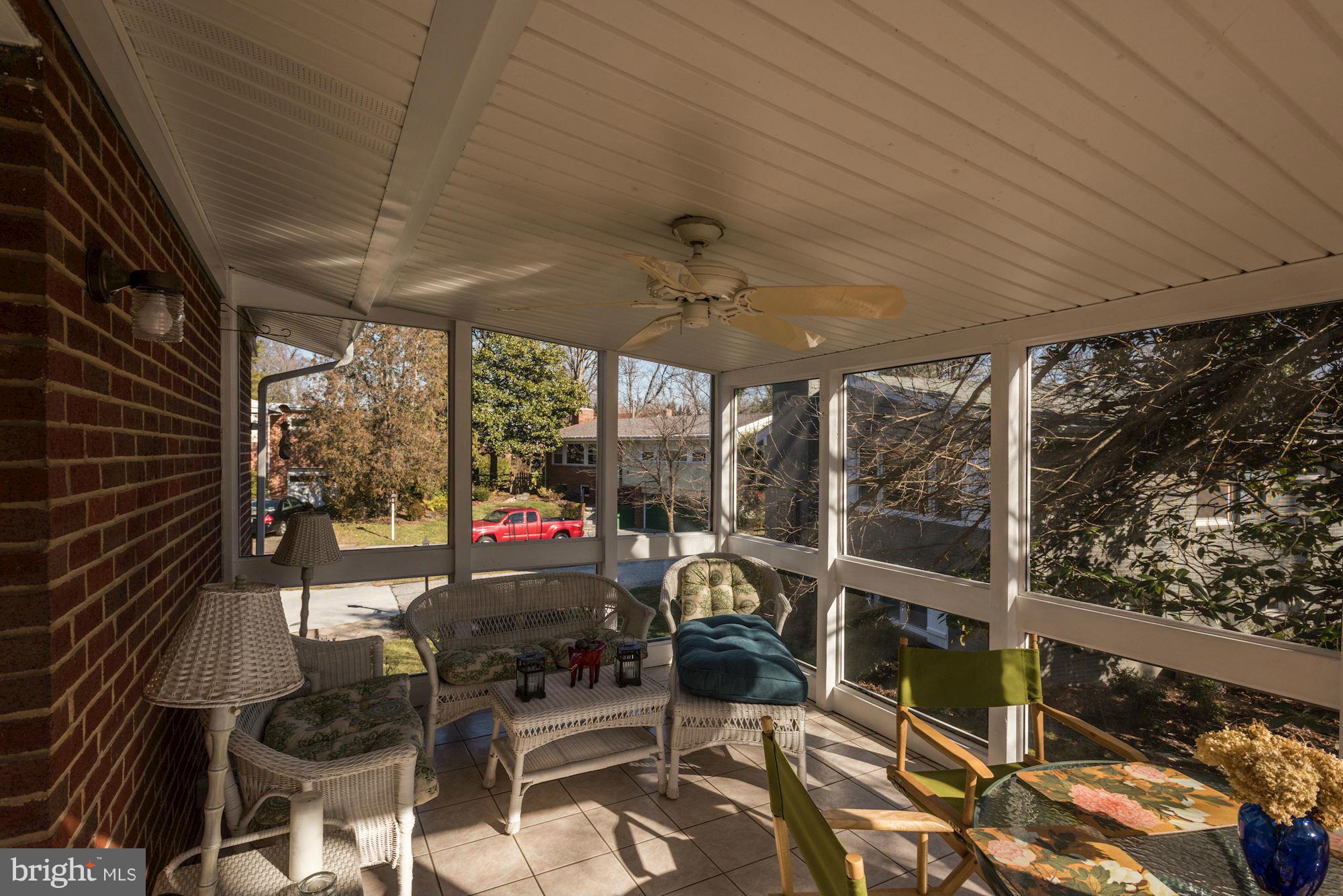 6705 Maxalea Road Baltimore, MD 21239 - Photo 25 of 30 a view of a patio with table and chairs next to a yard
