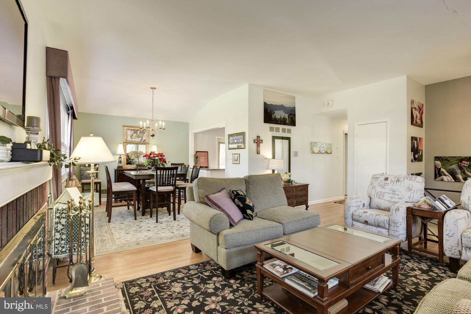 6705 Maxalea Road Baltimore, MD 21239 - Photo 6 of 30 a living room with lots of furniture and view of kitchen