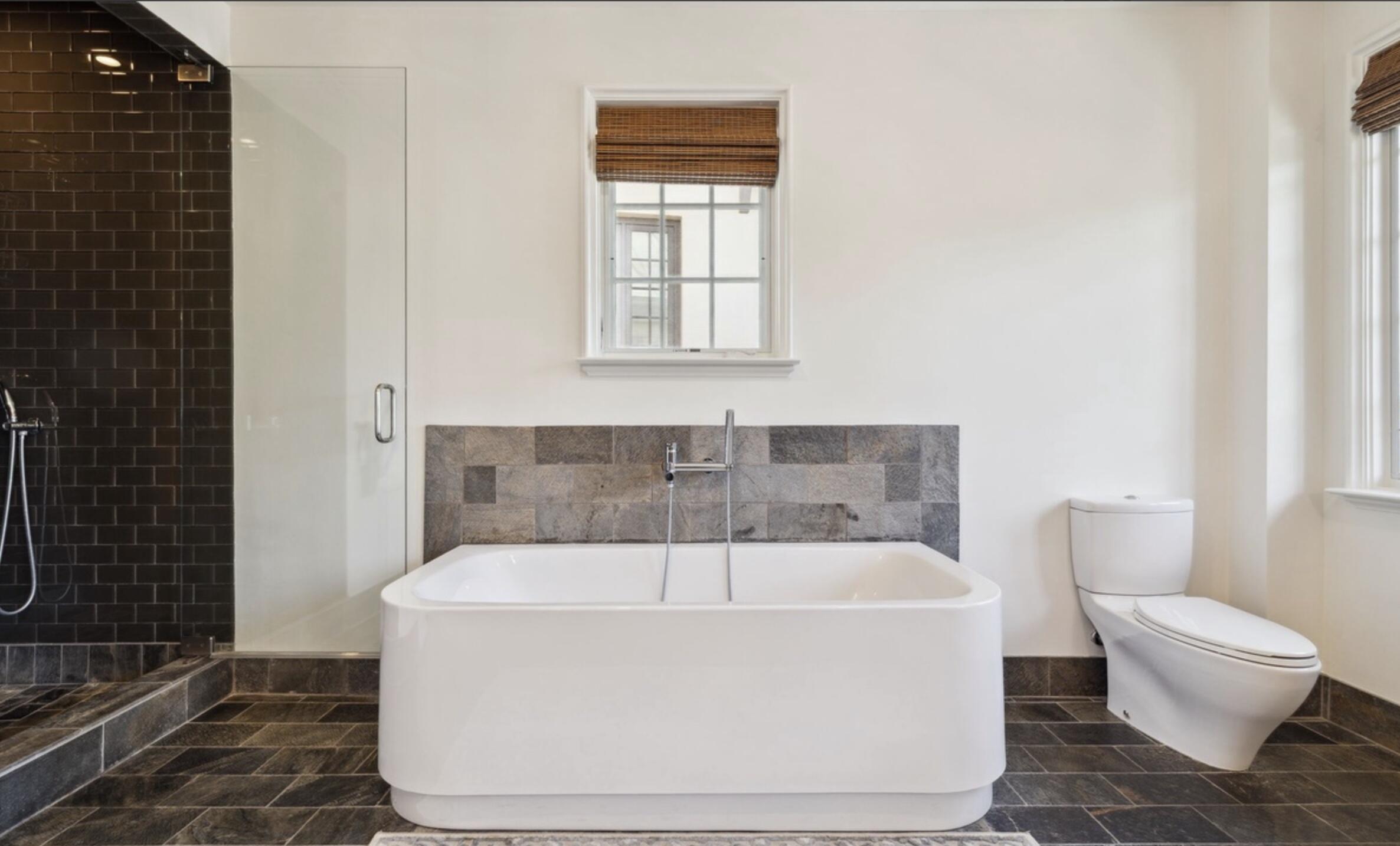 78 North Barrett Square, Unit 4 Inlet Beach, FL 32461 - Photo 20 of 36 a white bath tub sitting next to a toilet