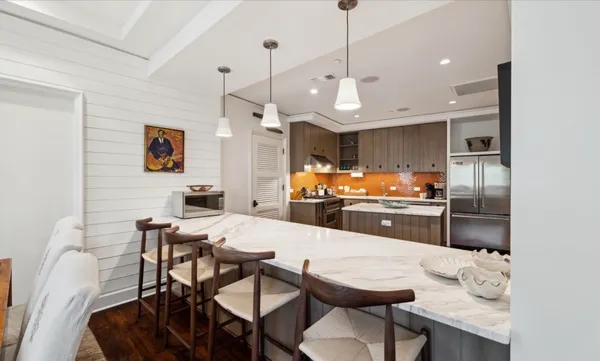 a bathroom with a sink a mirror and a toilet