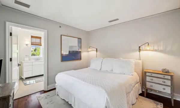 a kitchen with stainless steel appliances granite countertop a table chairs and stove