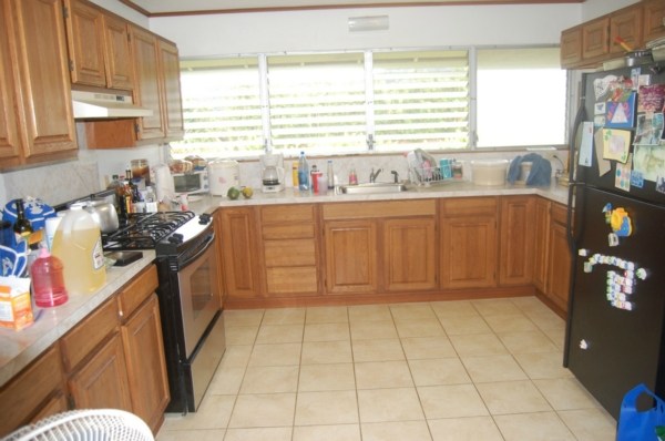 6224 Holio Road Kapaa, HI 96746 - Photo 4 of 14 a kitchen with stainless steel appliances granite countertop a sink and a stove