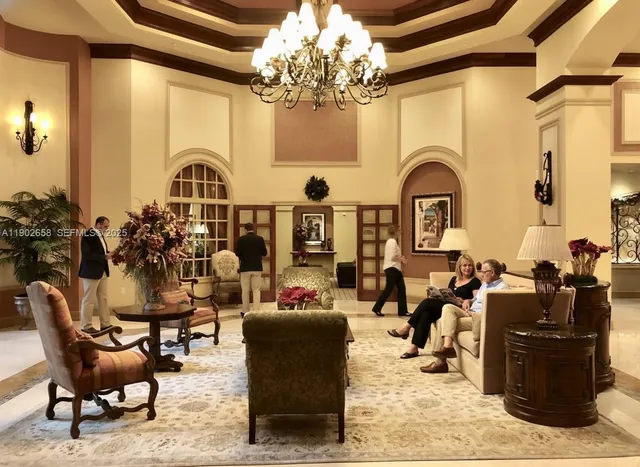 a view of a swimming pool with outdoor seating