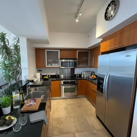 a view of a balcony with wooden chairs