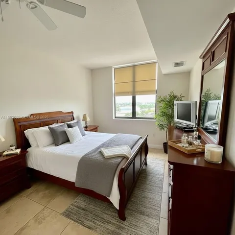 a bedroom with bed and a couch