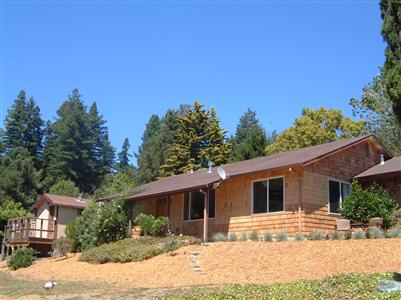 1205 Rim Of The Redwoods Road Sebastopol, CA 95472 - Photo 2 of 12 a house with trees in the background