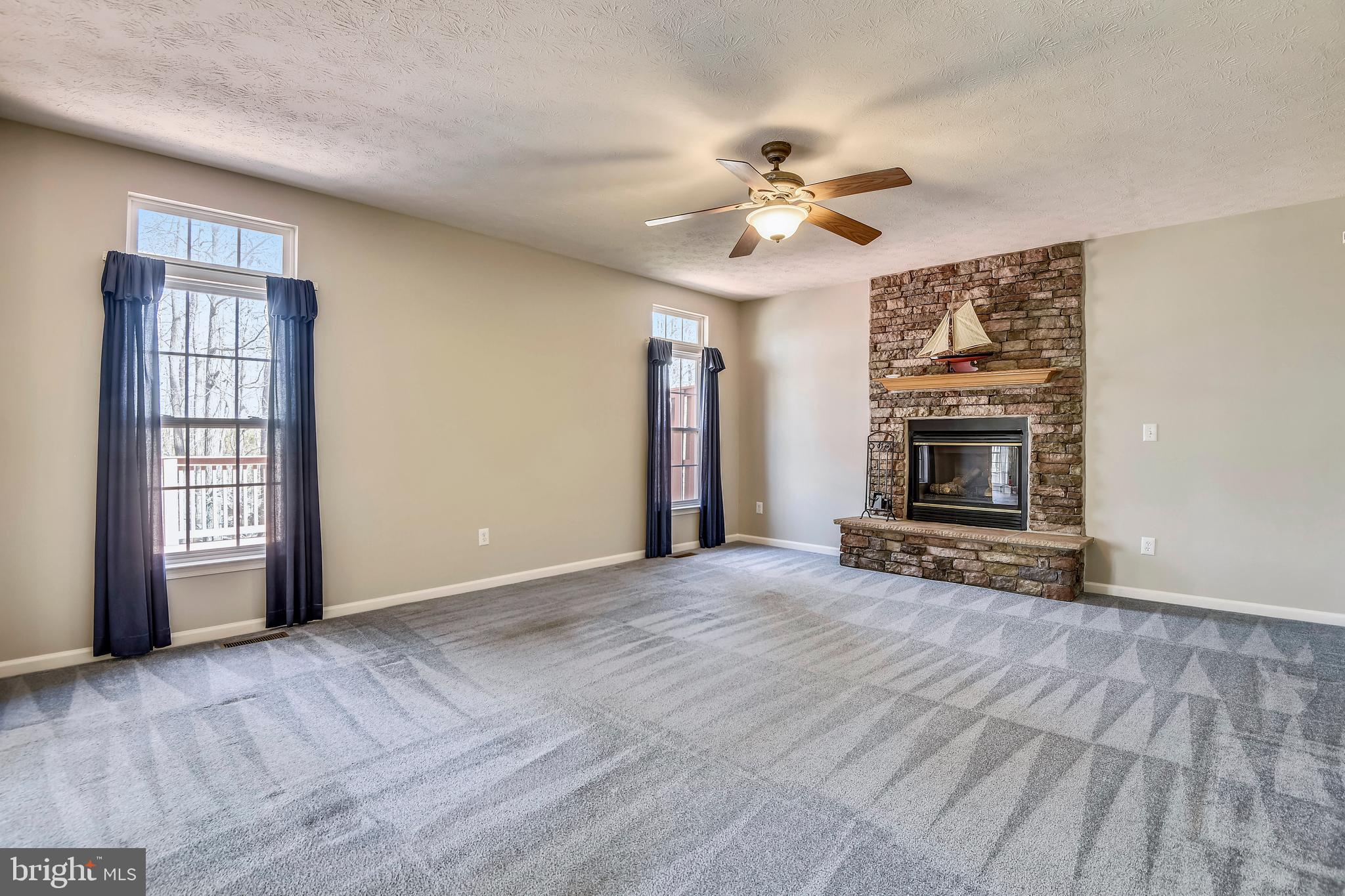 7762 Rotherham Drive Hanover, MD 21076 - Photo 17 of 65 Family Room with Stacked Stone Gas Fireplace