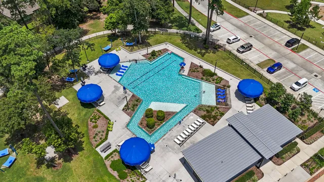 an aerial view of houses with backyard
