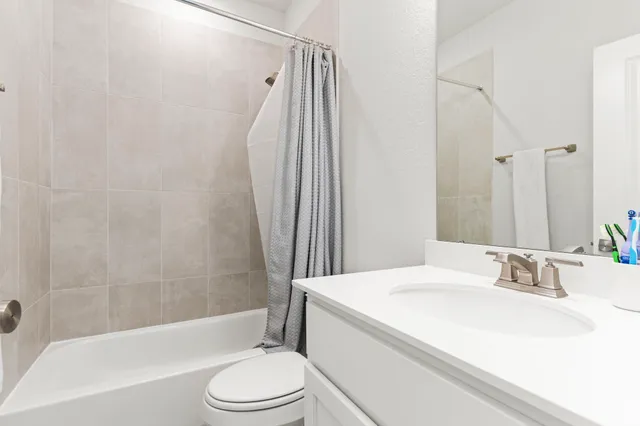 a view of hallway with wooden floor and staircase