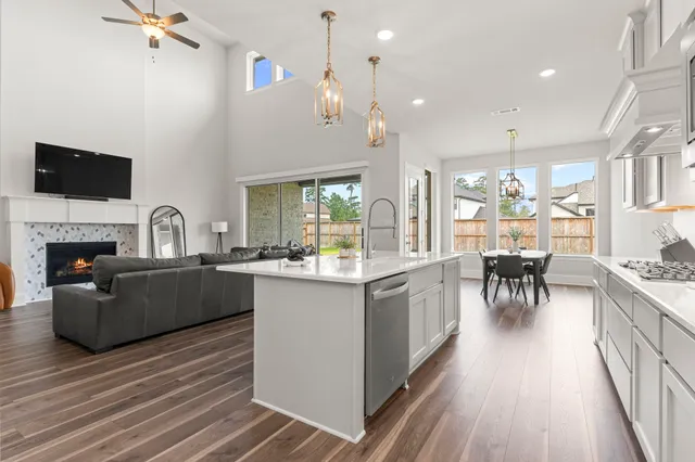 a living room with a fireplace and a flat screen tv