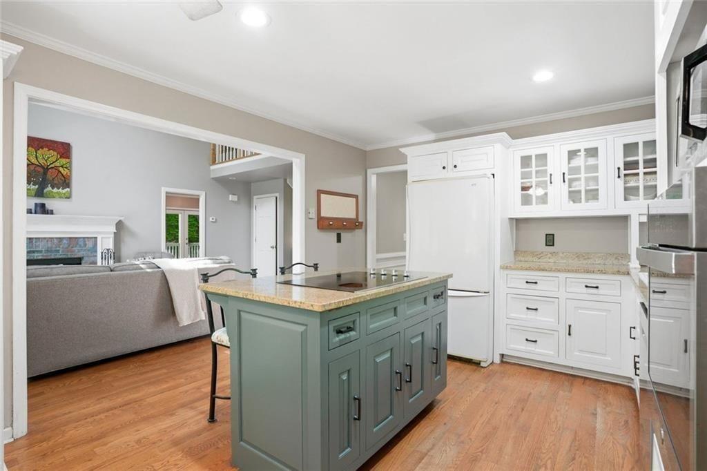 3259 Etchison Road Loganville, GA 30052 - Photo 15 of 50 a kitchen with a stove a sink and a refrigerator