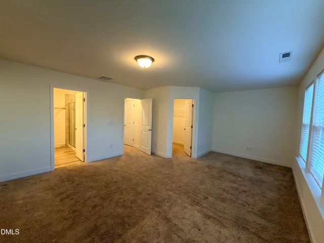 a bathroom with a double vanity sink mirror and double