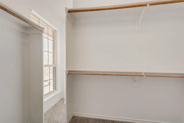 a view of an empty walk in closet
