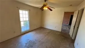 a view of empty room with windows