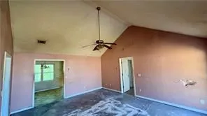 a view of a big room with closet and chandelier fan