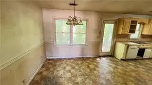 a utility room with sink dryer and washer