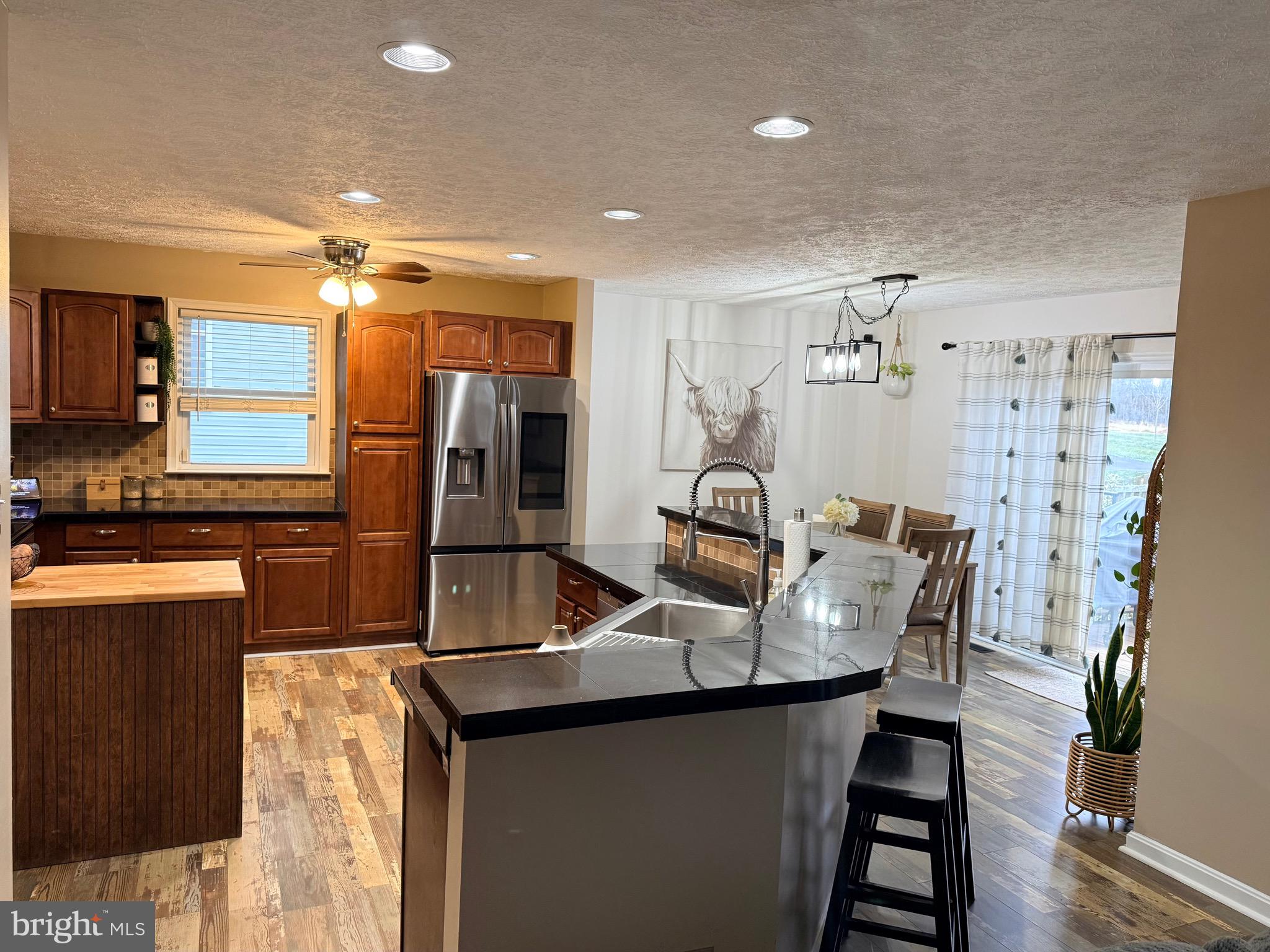 103 Broad Leaf Court Rising Sun, MD 21911 - Photo 11 of 47 a kitchen with stainless steel appliances granite countertop a sink refrigerator and cabinets
