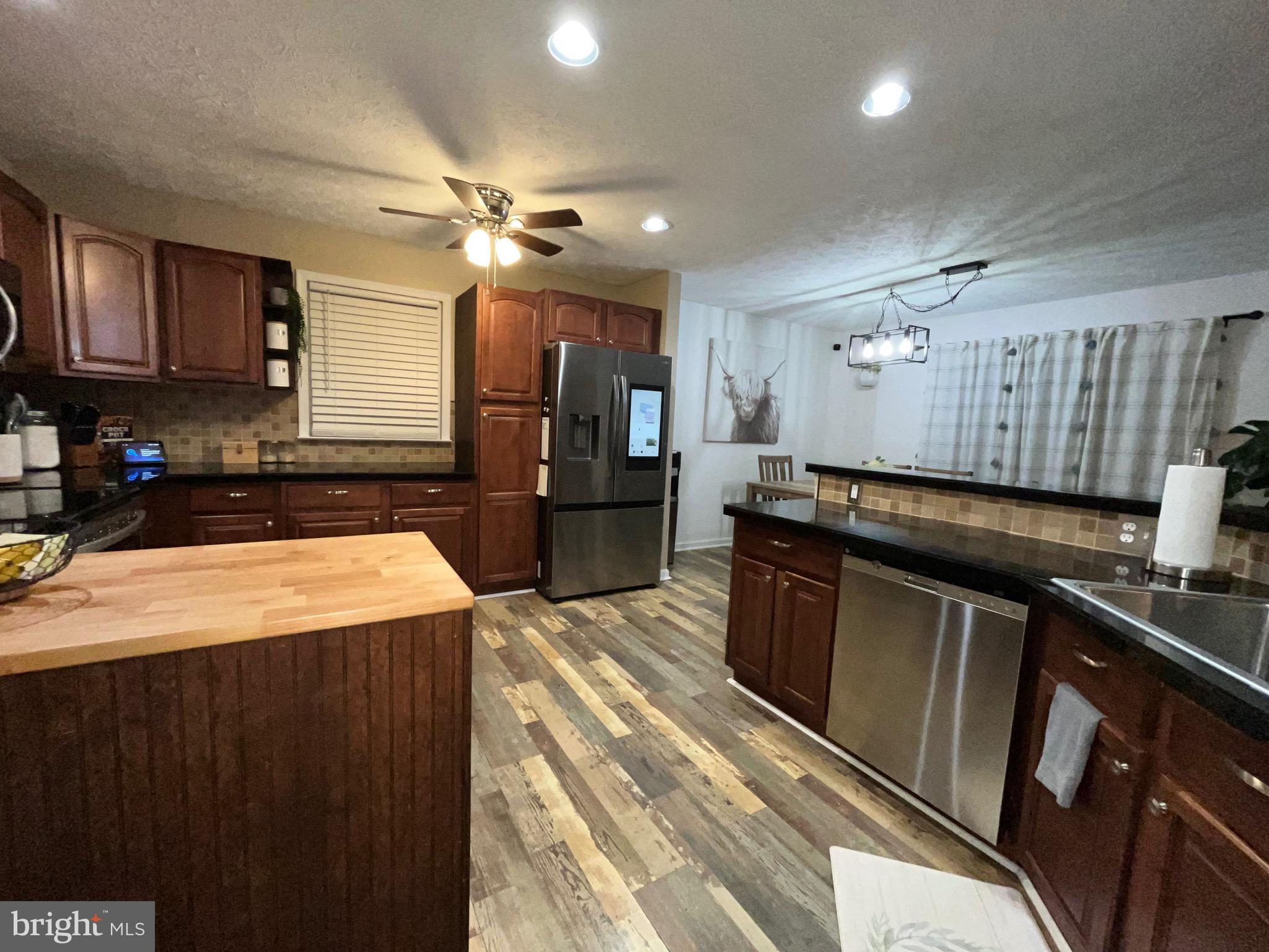 103 Broad Leaf Court Rising Sun, MD 21911 - Photo 14 of 47 a kitchen with stainless steel appliances granite countertop a sink a stove and a refrigerator