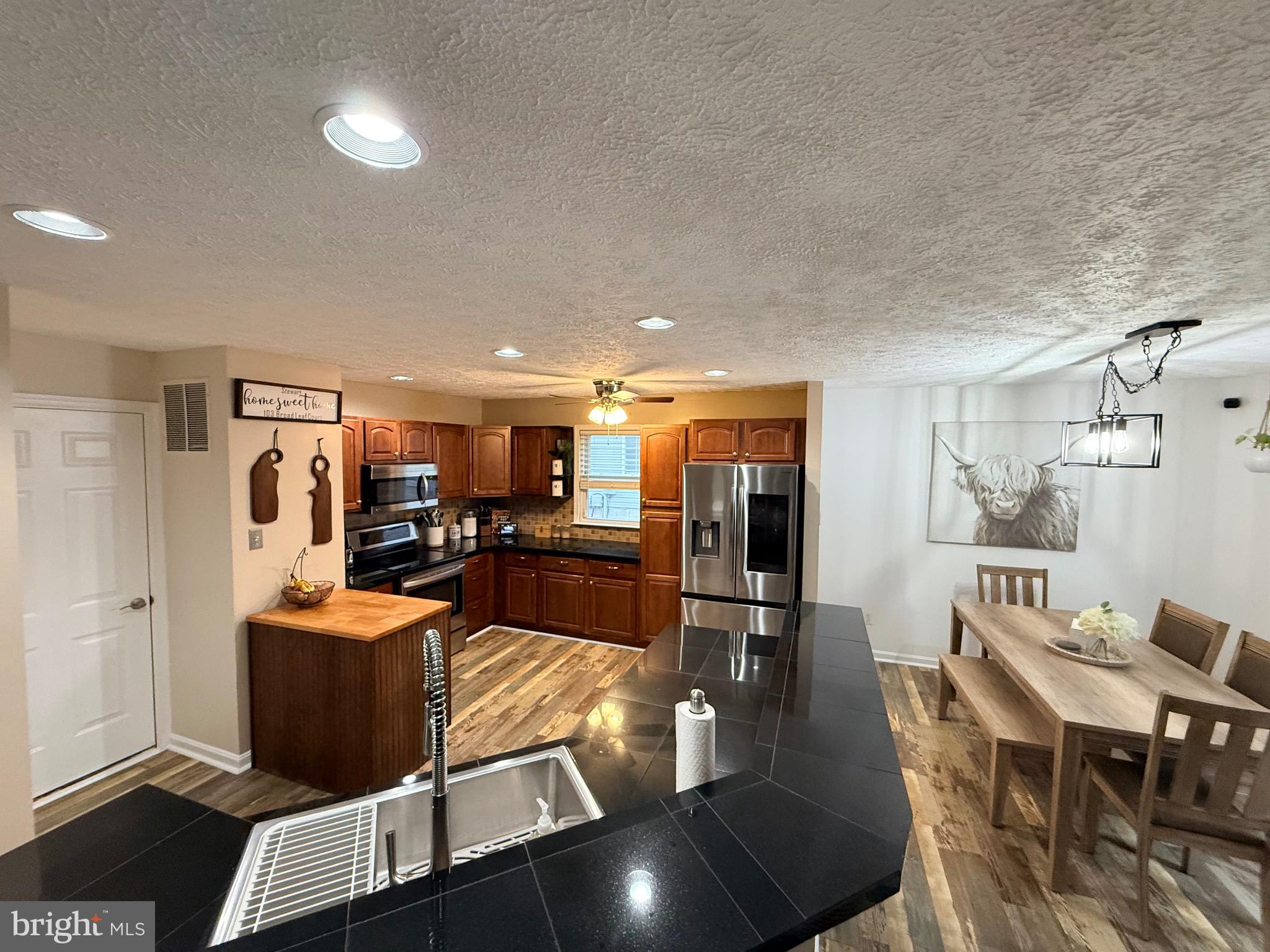 103 Broad Leaf Court Rising Sun, MD 21911 - Photo 16 of 47 a living room with lots of furniture and gym equipment