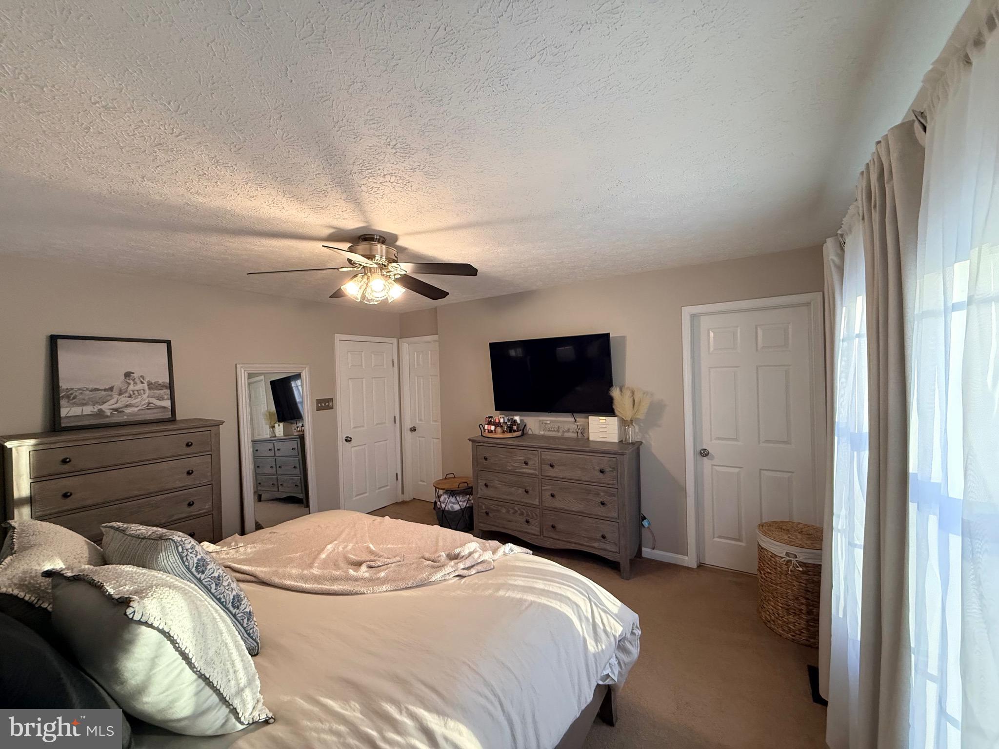 103 Broad Leaf Court Rising Sun, MD 21911 - Photo 25 of 47 a bedroom with a bed and a flat screen tv