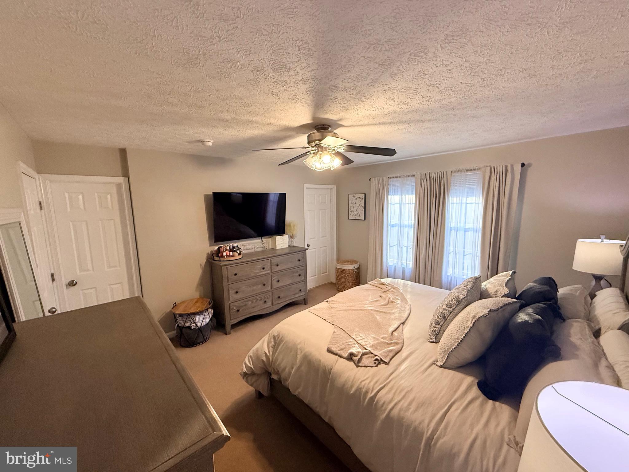 103 Broad Leaf Court Rising Sun, MD 21911 - Photo 26 of 47 a bedroom with a bed and a flat screen tv