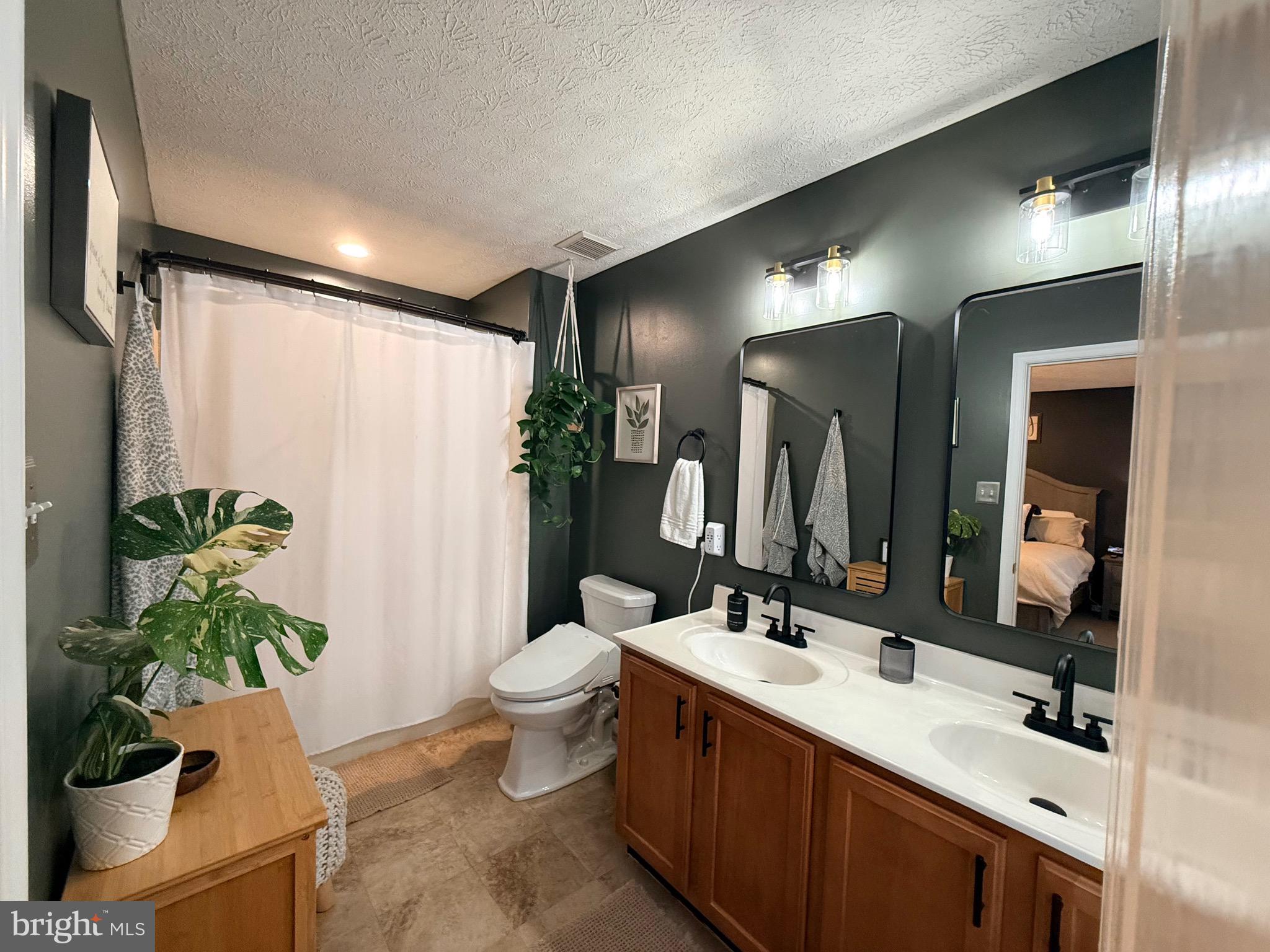 103 Broad Leaf Court Rising Sun, MD 21911 - Photo 27 of 47 a bathroom with a granite countertop sink and a mirror