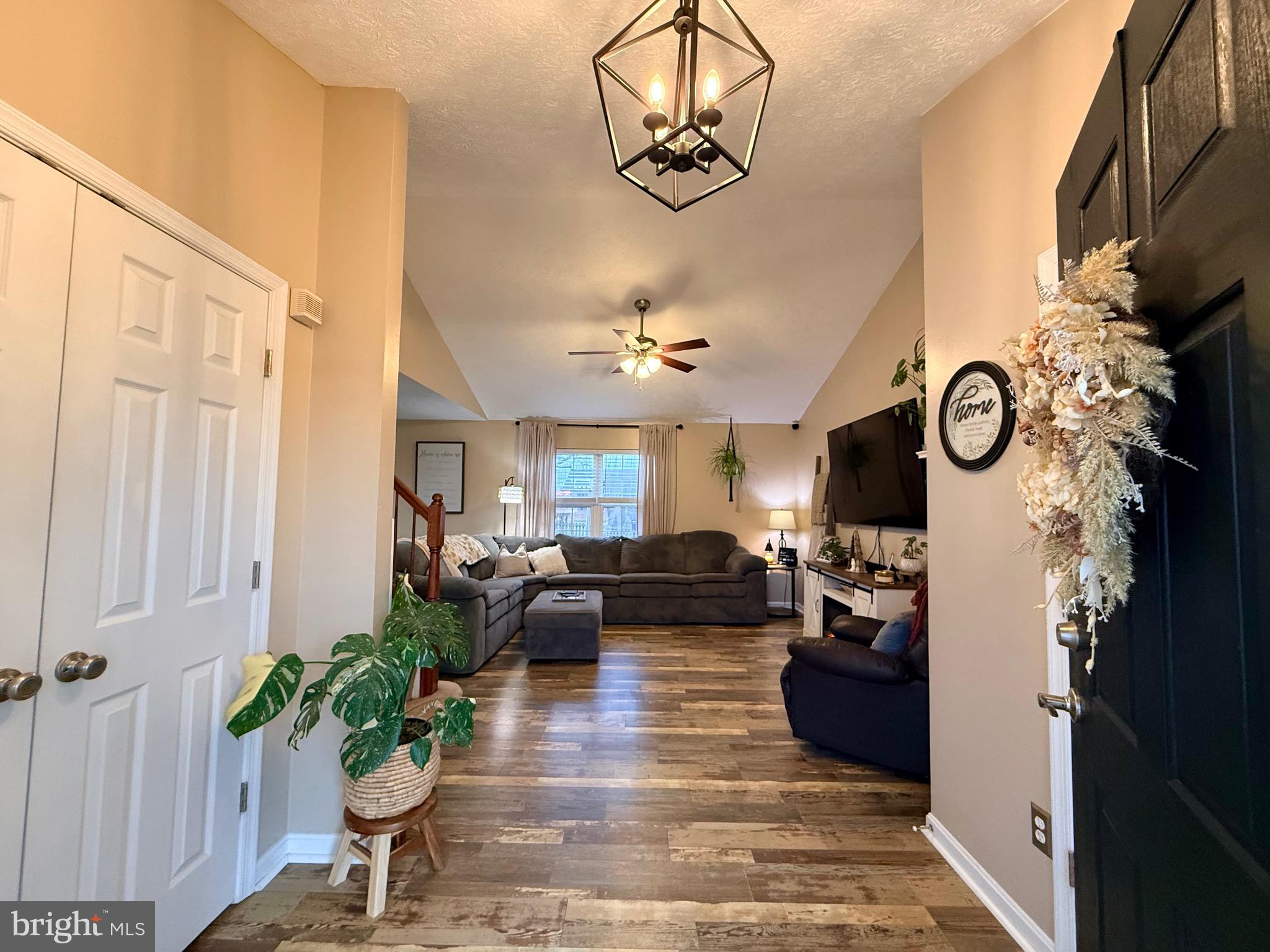 103 Broad Leaf Court Rising Sun, MD 21911 - Photo 6 of 47 a view of a livingroom with furniture wooden floor and a chandelier