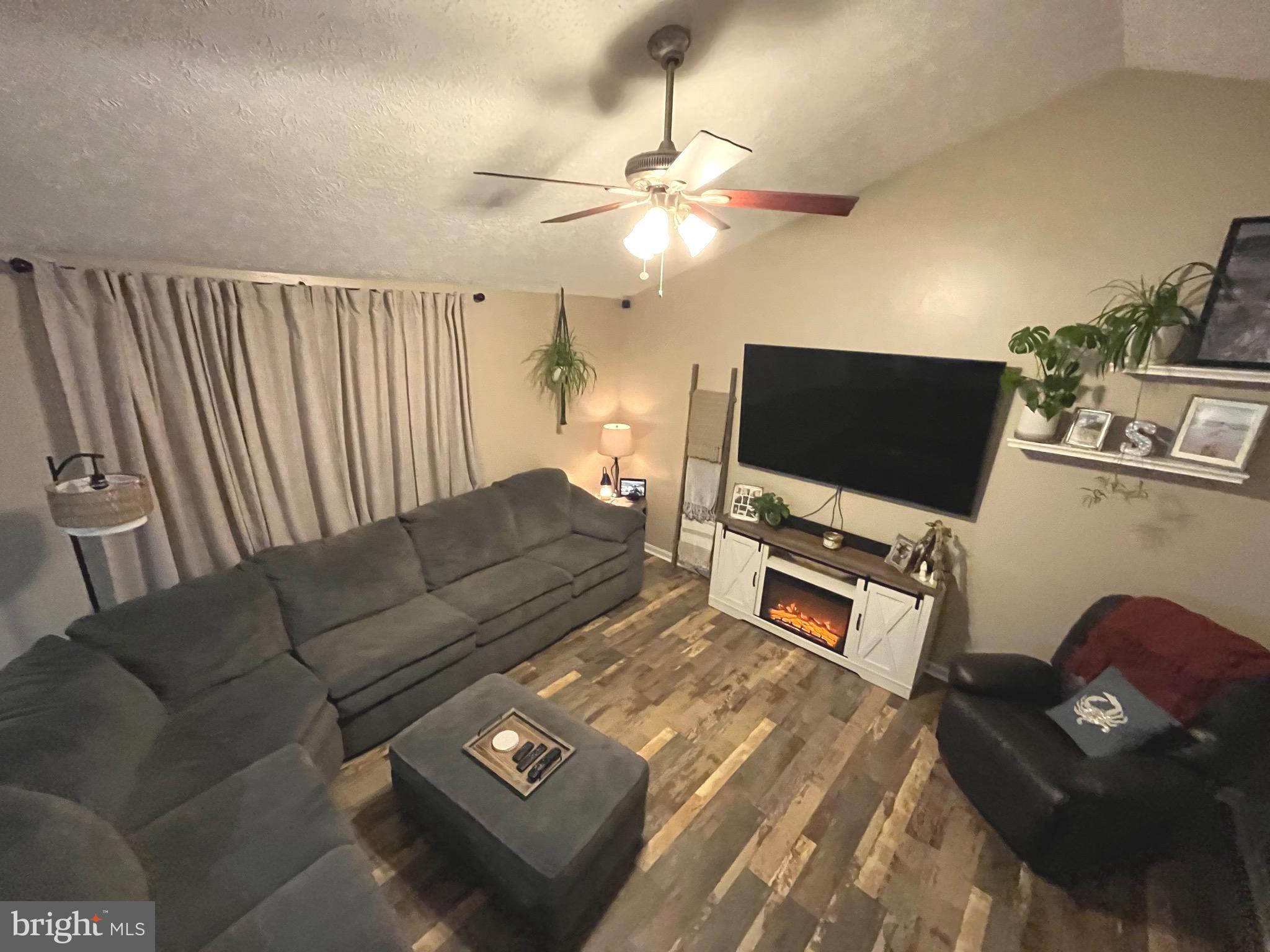 103 Broad Leaf Court Rising Sun, MD 21911 - Photo 8 of 47 a living room with furniture and a flat screen tv