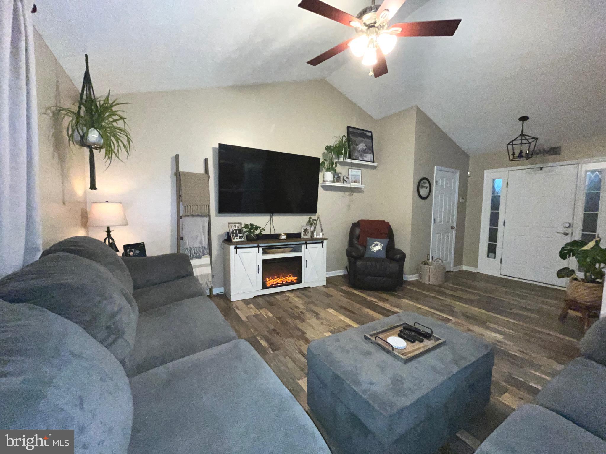 103 Broad Leaf Court Rising Sun, MD 21911 - Photo 9 of 47 a living room with furniture and a flat screen tv